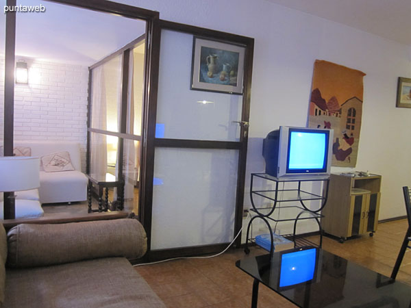 General view of the living room from its end next to the window towards the entrance of the apartment.