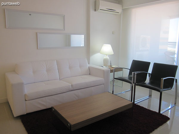 General view of the living room from the end next to the window that leads to the balcony terrace towards the kitchen.