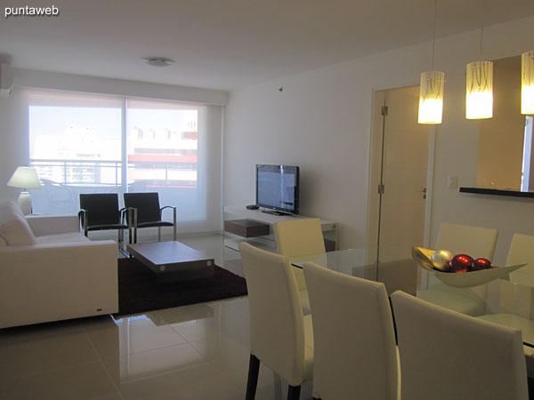 General view of the living room from the corner next to the kitchen bar.