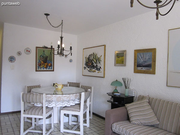 General view of the living room from the east end next to the exit to the balcony terrace towards the dining space.