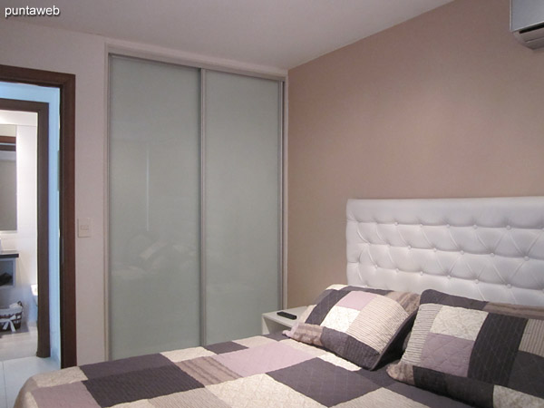 The bedroom has wardrobe / closet sliding doors.