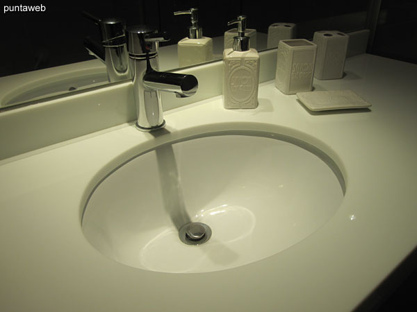 Detail of faucets and sanitary fixtures in the bathroom of the second suite.