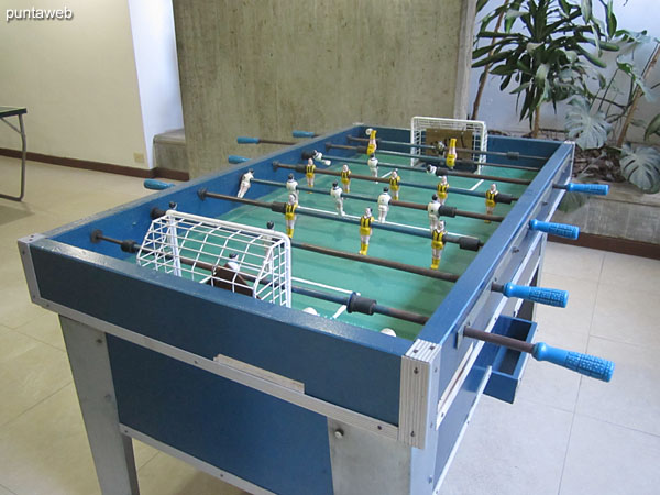 Game room for teenagers. located in the basement of the building. It has foosball and ping pong tables.