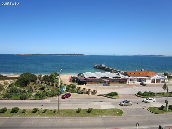 View towards the bay of Punta del Este, on the Mansa beach, Gorriti island and fishing pier of the Fishing Club from the window of the closed and roofed balcony.