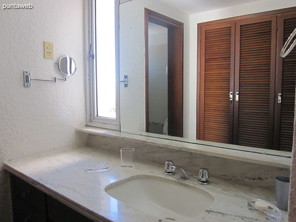 Bathroom of the suite. It has a window, shower and glass screen.