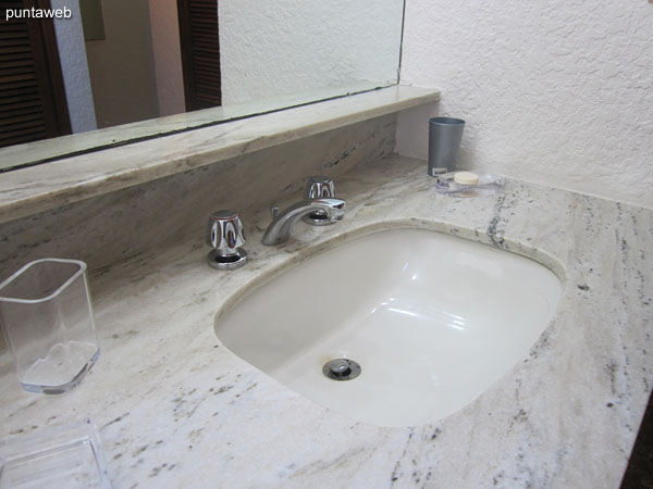 Detail of taps and sanitary fixtures in the bathroom of the suite.