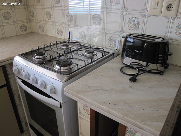 Gas stove with four burners.