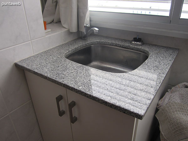 Laundry sink integrated into the kitchen.