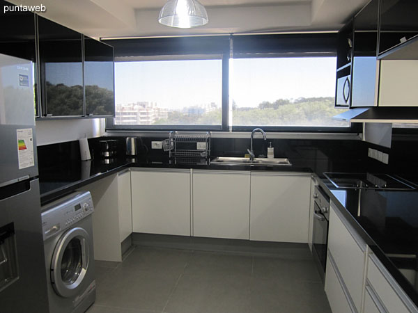 Kitchen with bar connecting to the living room.