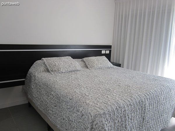 Suite room. Located towards the east side, it offers views towards the side garden of the complex.<br><br>Equipped with double bed, cable TV.<br><br>The space has a dressing room with shelves and closets to the bathroom.