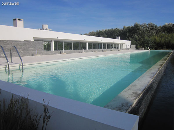 Outdoor pool. In the background, the barbecue.