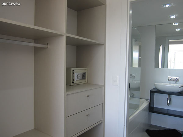 Closet detail and shelves in the suite. It has a security chest.