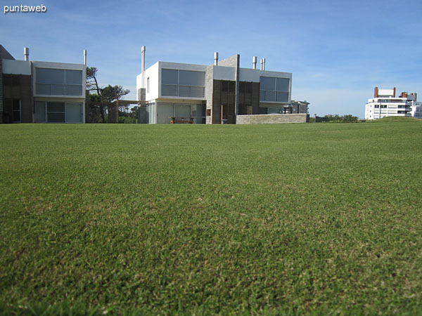 Golf four holes. In the background, the residences.