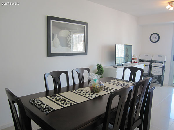 Rectangular wooden table with six chairs.