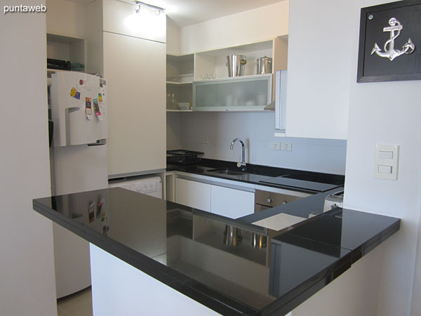 American type kitchen with integrated bar to the living room.