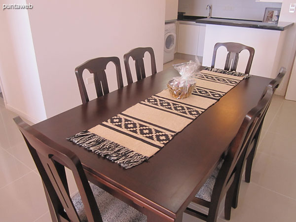 Rectangular wooden table with six chairs.