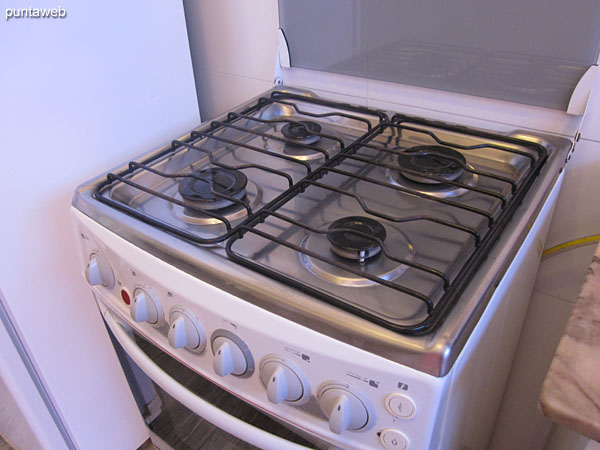 Gas stove with four burners.