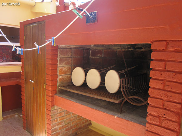 Patio next to the outdoor kitchen with barbecue.