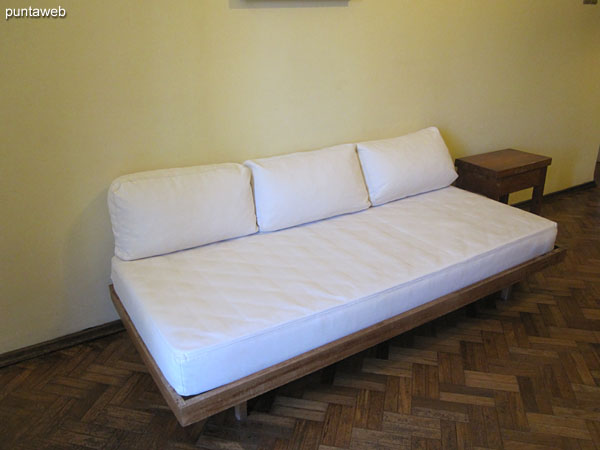 Sofa bed in the living room. It has two equal to the sides of the environment.