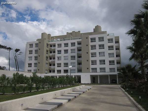 View towards the facade of the building's back of the building from the vehicle access.