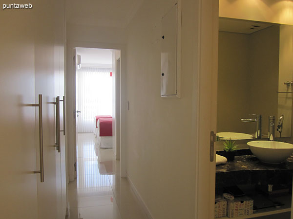 Access corridor to the two remaining suites. To the right of the image the toilette.