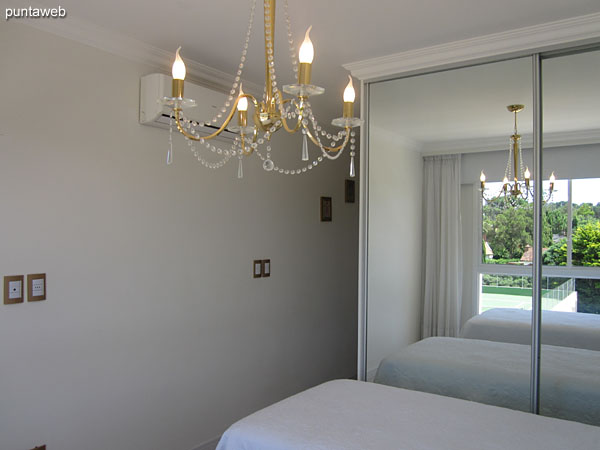 Large closets of mirrored doors in the third suite.