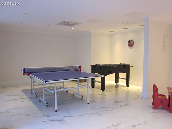 Playroom for children and adolescents. Located lobby level of the building.<br><br>Equipped with ping–pong, foosball and other games for children.