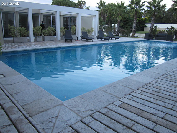 General view of the outdoor pool in the garden at the back of the building.<br><br>At the bottom of the image the barbecue sector.