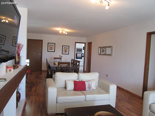 General view of the living room from the access window to the covered and closed terrace balcony.