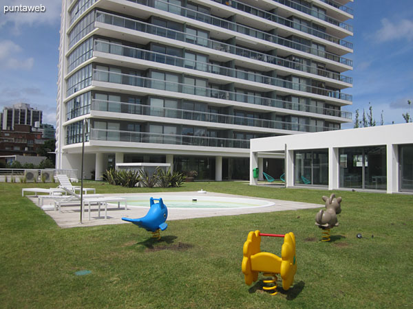 View of the facade of the building from space barbecue in the garden.