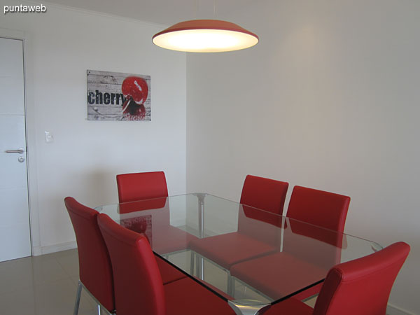 Dining room. Located at the entrance to the apartment in front of the bar kitchen.<br><br>Equipped with glass table and six chairs.