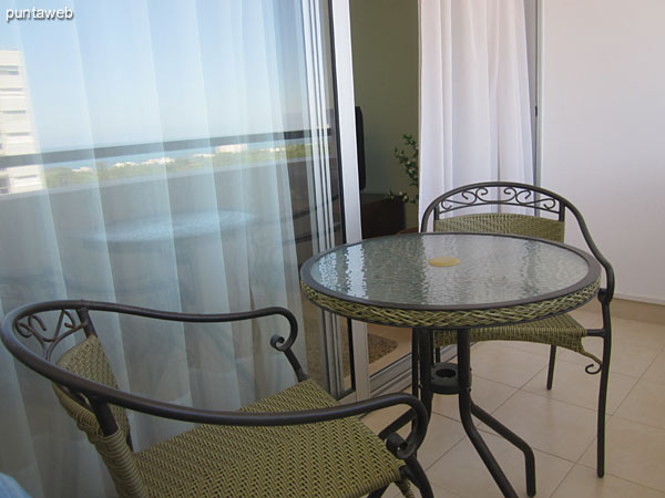 Detail of table and chairs on the terrace balcony.