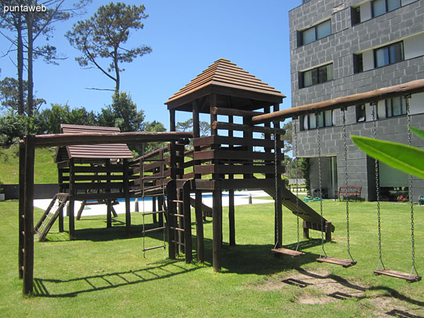 Detail playground for kids in the garden of the building.