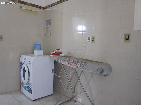 Laundry. Access from the kitchen and separate door. Very wide. Equipped with sink and washing machine.