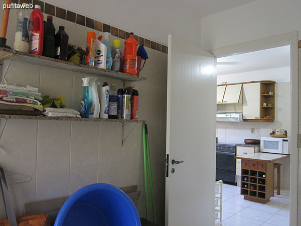 Laundry. Access from the kitchen and separate door. Very wide. Equipped with sink and washing machine.