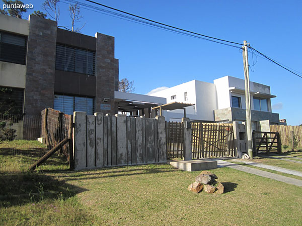 Access to the house, has a gate and perimeter fence.