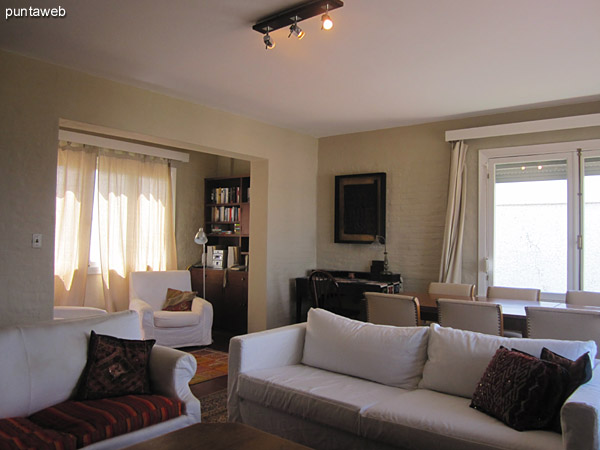 General view of the living room from the southeast corner next to the front and side windows.