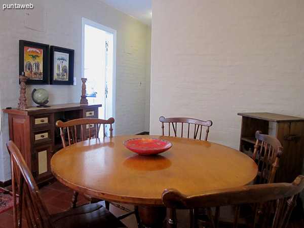 Partial view of living room from the dining room area to the front. <br><br>TV with cable TV and Wi–Fi internet access.